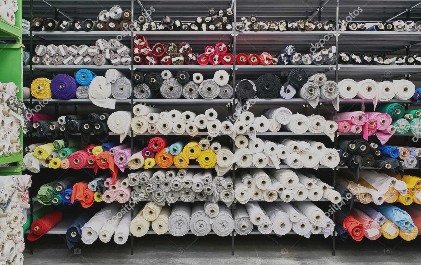 depositphotos_286880336-stock-photo-fabric-warehouse-with-many-multicolored2